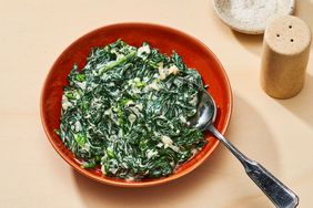 easy creamed spinach in red serving bowl