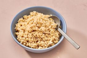 brown rice in bowl with spoon