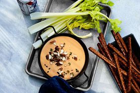beer cheese with pretzels and celery for dipping