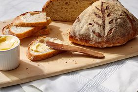 artisan boule bread martha bakes cutting board slice butter