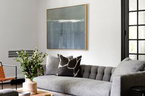 grey couch wall decor modern space