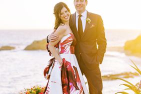 bride and groom posing by the ocean
