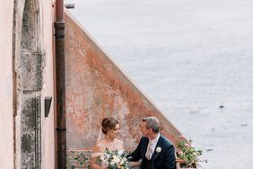 cara david wedding couple sitting on steps above coast