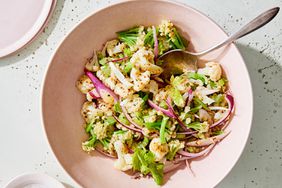 cauliflower faux-tato salad served in a pink bowl