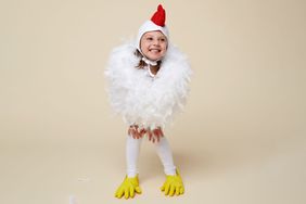 little girl in chicken costume
