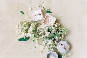 wedding bands in boxes with flowers