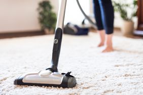 Cleaning carpet with vacuum