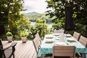 Outdoor deck with decorated dining table and plants