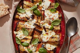 eggplant involtini with fresh tomato sauce topped with fresh basil leaves