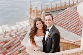 bride and groom smiling on outdoor staircase