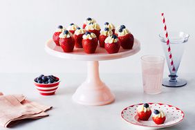 filled strawberries on cake platter