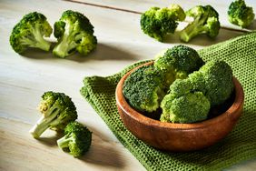 broccoli in wood bowl on table