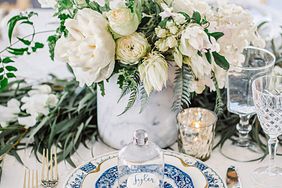 Tablescape with white floral centerpiece, blue and white china, and macarons, hannah steve wedding california