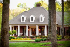 beautiful home with porch and spring landscaping