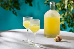 two glasses of limoncello liqueur on table