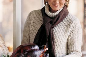 Martha Stewart holding Grilled Turkey Platter