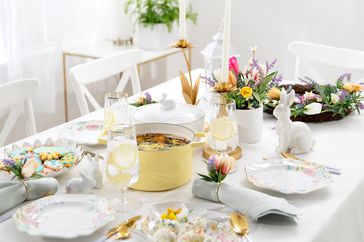 tablescape set for easter with bunnies and floral decor