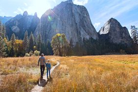 Father and Son walking in Yosemite Park in California