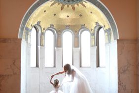 A Bride and Flower Girl Dancing
