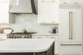 neutral kitchen with luxury appliances and textured tile