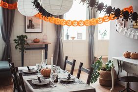orange and black halloween decorations table setting