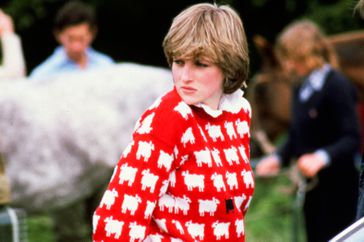 Princess Diana in 1981 wearing a red jumper with white sheep pattern
