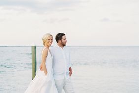 bride and groom walking down the dock