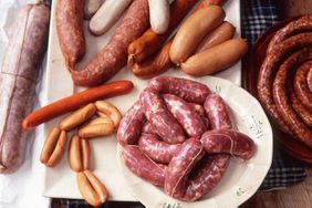 variety of sausages on white platter