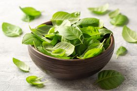 Basil in wooden bowl