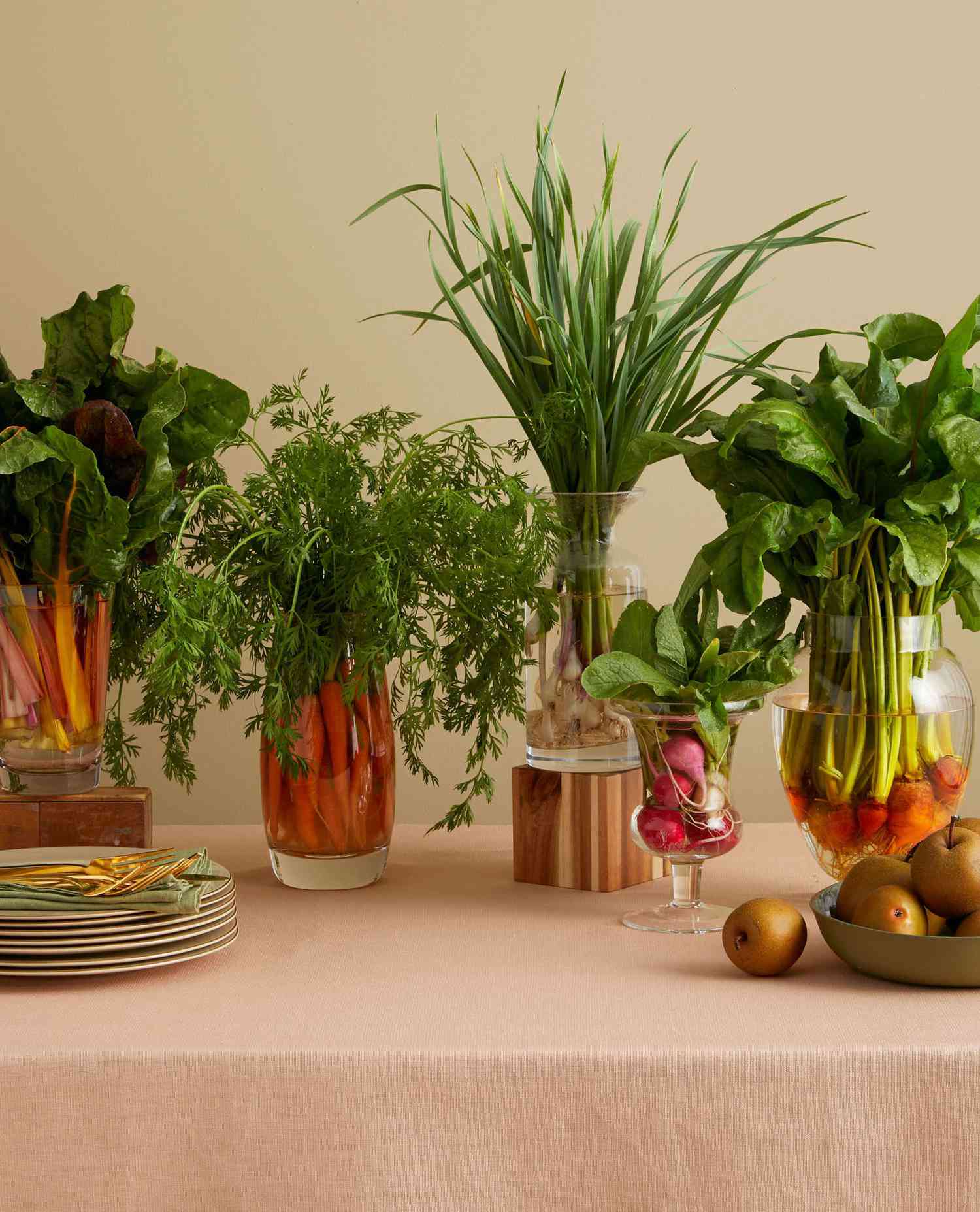 vegetables in clear vessels as a Thanksgiving autumnal centerpiece