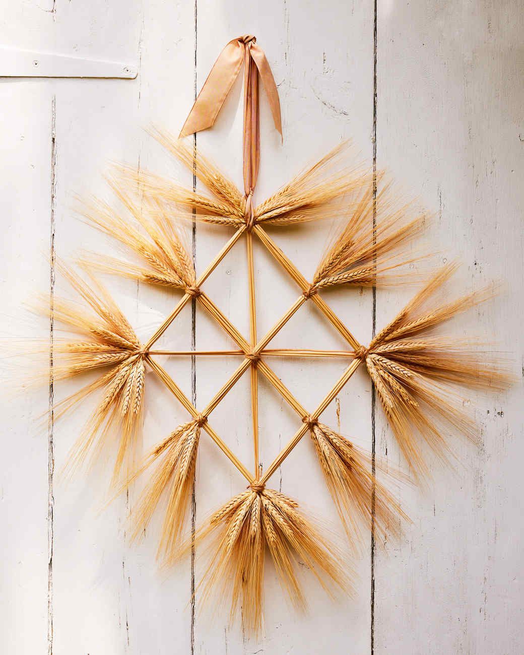 wheat grid wreath hanging from white barn door