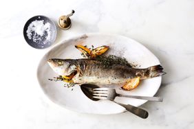 Whole-Roasted Branzino with Lemon and Thyme on plate