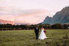 yolana douglas wedding couple in field in front of mountains